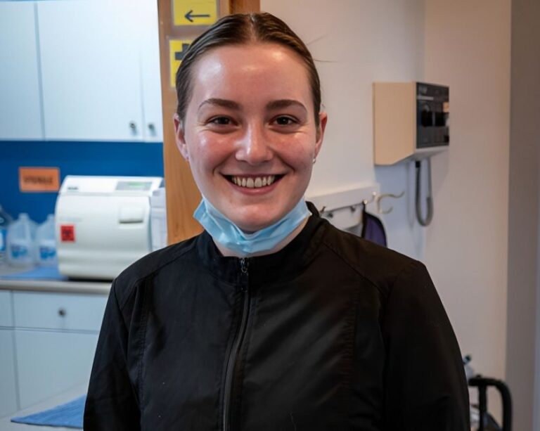 dental team member smiling at west coxsackie office